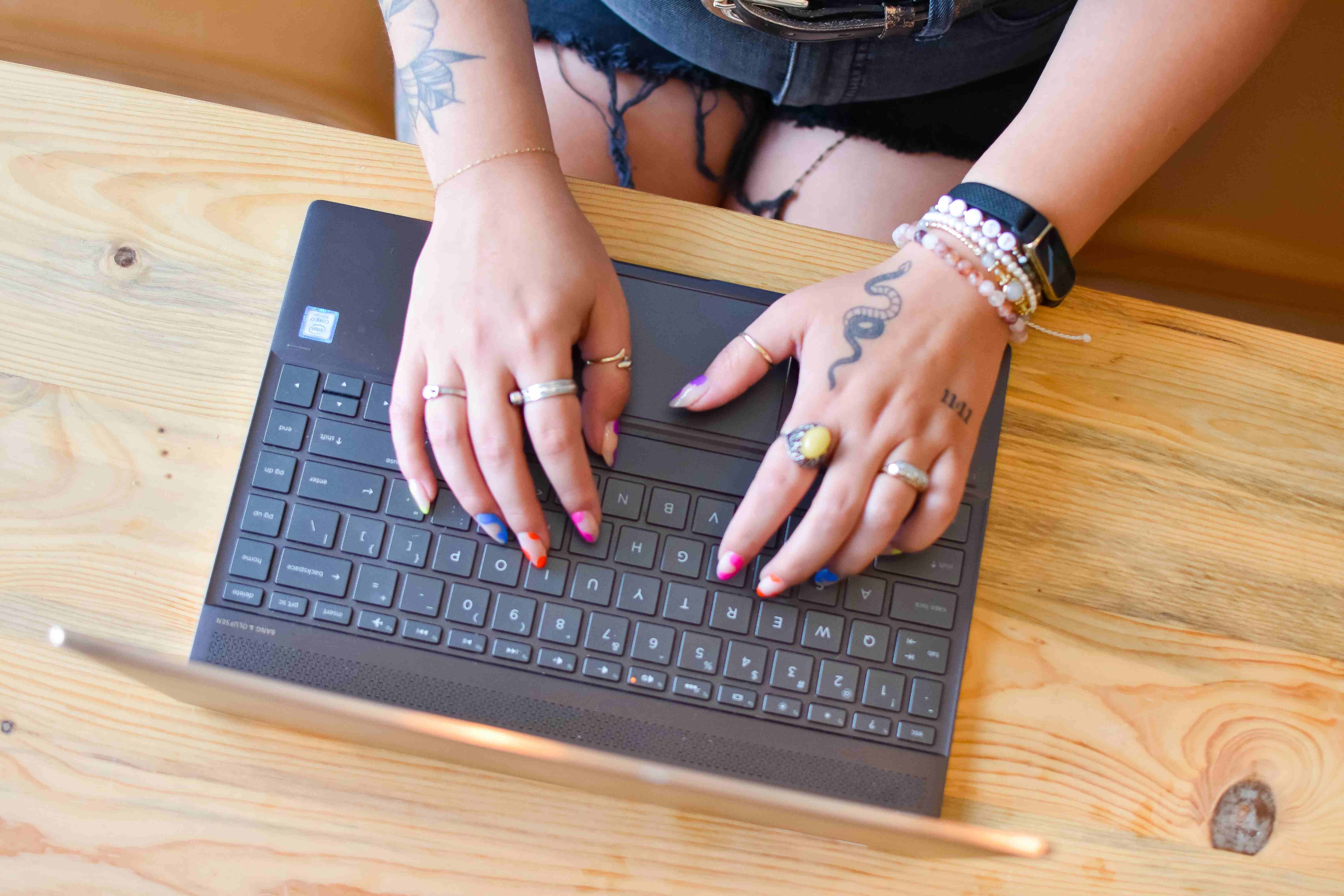 Jen typing on her laptop